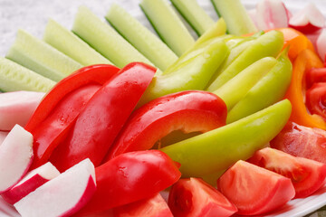 Fresh slices of vegetables. Bio. Red pepper, green pepper, tomato, cucumber, radish.
