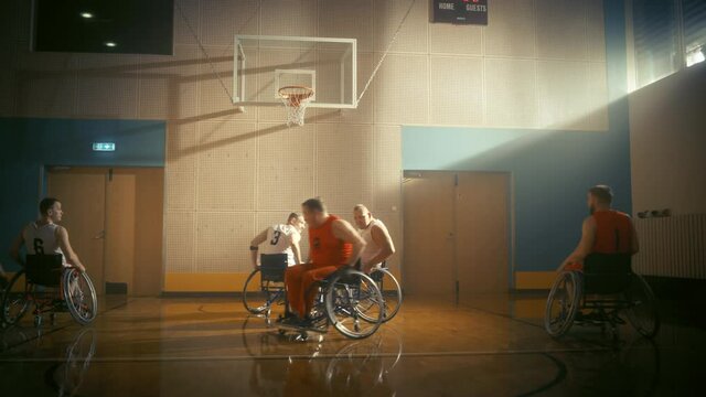 Wheelchair Basketball Game: Professional Players Competing Energetically, Dribbling Ball, Passing, Shooting it in the Basket, Missing the Net. Determination and Skill of a People with Disability
