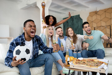 Emotional multiracial friends watching football match together at home, screaming GOAL, celebrating victory