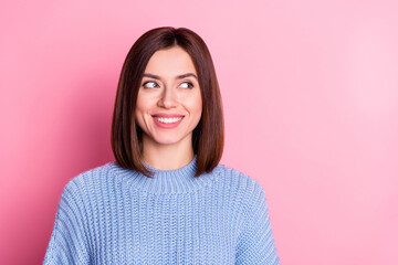 Fototapeta premium Portrait of attractive curious cheerful brown-haired girl looking aside copy blank place space isolated over pink pastel color background