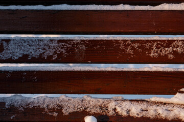Boards covered with snow. snow on the boards.