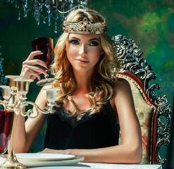 young blond woman wearing crown in fairy luxury interior with empty antique frames total wealth...