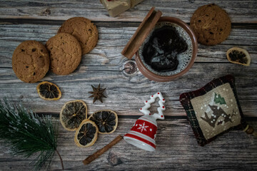 Moscow, Russia, December 2021, New Year card, background, Christmas decor, gift, cup with a drink and cookies on a dark wood background