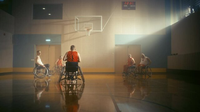 Wheelchair Basketball Game: Professional Players Competing, Dribbling Ball, Passing, Shooting and Scoring Perfect Three Point Field Goal. Celebration of Determination, Skill of People with Disability