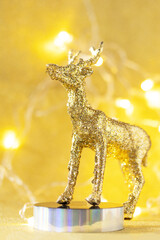 Magic of christmas. Christmas deer gold color palette with decor on a gold background for your greeting card.