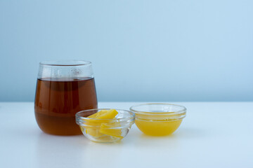 Cup of black tea among products for improving immunity and treating colds - lemon, honey. Space for text