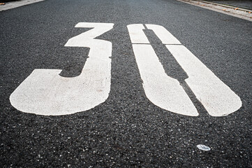 The traffic sign 30 KM/h was written on the asphalt