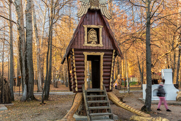 Baba Yaga's wooden house stands in the park.