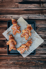 Homemade dough men  - called in German Grittibänzli - made with sweet yeast dough and covered with decorative sugar. Swiss tradition to bake dough men on December 6 and in Advent time.