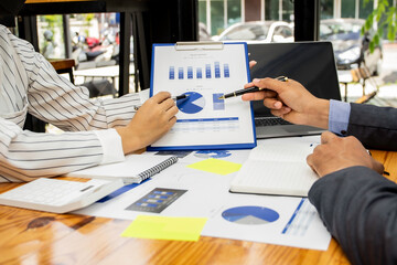 Business people discuss income and performance-based marketing in past meetings, financial advisors analyze data with investors, business ideas working with a team of colleagues and market planners.