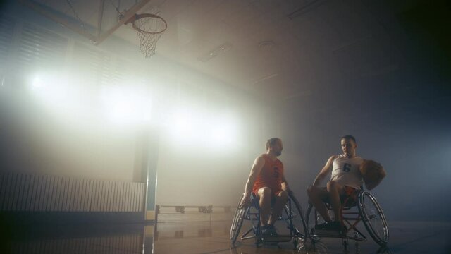 Wheelchair Basketball Game One on One: Professional Players Competing, Dribbling, Shooting it Successfully, Score a Perfect Goal. Determination, Skill of People with Disability. Slow Motion