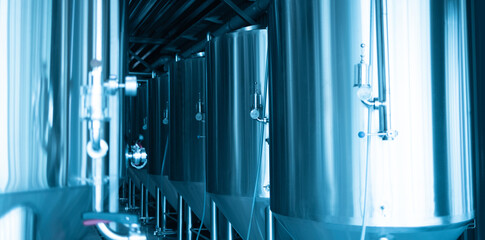 Obraz premium Manometers on steel cylinder storages or vats or tanks on beer and cider production plant, industry machine equipment