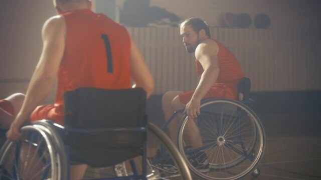 Wheelchair Basketball Game Court: Active Professional Players Competing, Passing, Shooting it Successfully, Scoring Points. Determination and Skill of a People with Disability. Slow Motion