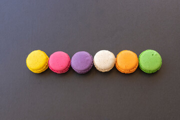 Cake macaron or macaroon on black background, colorful macaroons .Colorful macaron cakes .