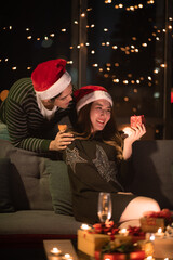 young Asian couple in night celebration with romantic love together, happy holiday Christmas party