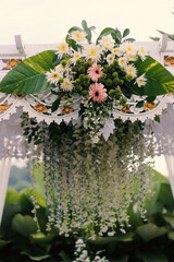Fototapeta na wymiar Wedding arch, wedding, wedding moment, wedding decorations, flowers, chairs, outdoor ceremony in the open air, bouquets of flowers 