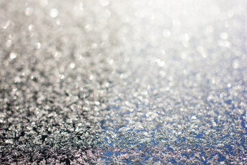 Photo of ice crystals on a smooth surface with blurred backgrounds and bokeh