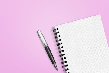 Office pen and notebook on background is equipment for using drawing and writing notes in.