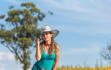 Blonde Brazilian woman posing for photos in rural landscape