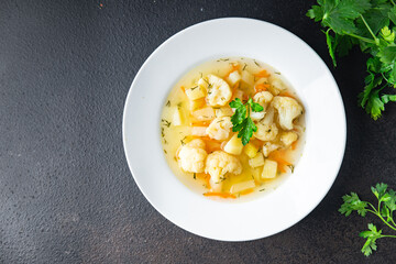 cauliflower soup vegetables first course vegetable broth healthy meal diet snack on the table copy space food background rustic. top view keto or paleo diet veggie vegan or vegetarian food no meat