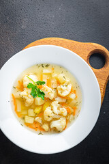 cauliflower soup vegetables first course vegetable broth healthy meal diet snack on the table copy space food background rustic. top view keto or paleo diet veggie vegan or vegetarian food no meat