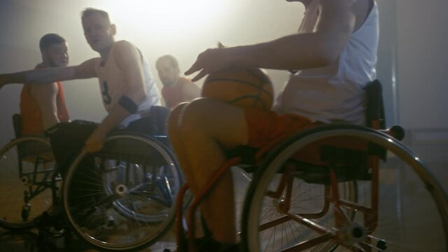 Wheelchair Basketball Game Court Winning Team Celebrate Victory, Cheer and High Five. Players Compete, Shoot, Score Goal Points. Determination, Skill of People with Disability. Slow Motion Shot