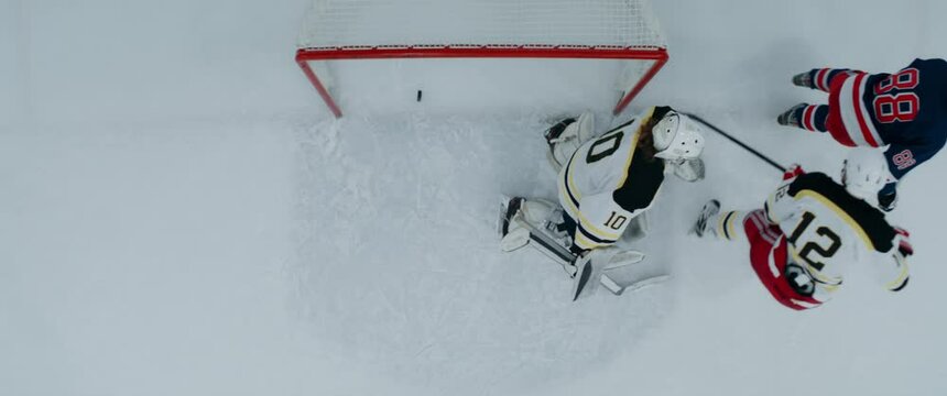 OVERHEAD HIGH ANGLE Player Scoring A Goal During The Hockey Game. Shot With 2x Anamorphic Lens