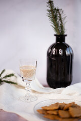 Homemade eggnog with for Christmas and winter holidays. Homemade eggnog in glass arranged with gingerbreads. 