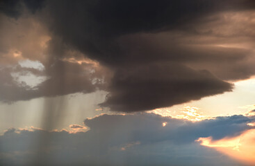 Naklejka na ściany i meble Landscape of dark clouds forming on stormy sky during thunderstorm