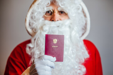 Santa Claus holding his passport