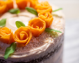 Close Up of Persimmon Roses on a Cake
