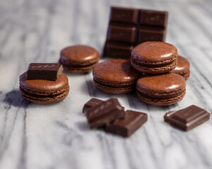 Dark Chocolate Macarons on White Marble