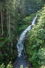 Obraz na płótnie Canvas small mountain waterfalls inside forest