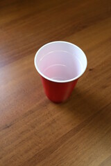 Red plastic cup on the office table