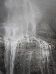 Fototapeta na wymiar big waterfall over rocks in switzerland