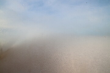 Blue sky through opaque glass