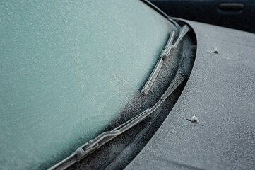 Car covered with ice and icicles after freezing rain. ice storm