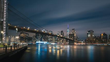 Night time view of Brooklyn Bridge (from Dumbo) and Lower Manhattan Skyline at Blue Hour, New York City
