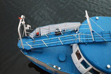 Top view of the bow of a river vessel in blue.