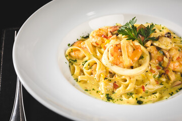Perfect Seafood Menu Dish Plate Food Octopus Salmon, Shrimp Risotto Pasta Vegetables Salad Fish on a Dark Background