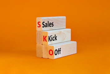 SKO sails kick off symbol. Concept words SKO sails kick off on wooden blocks. Beautiful orange table, orange background, copy space. Business and SKO sails kick off concept. - obrazy, fototapety, plakaty