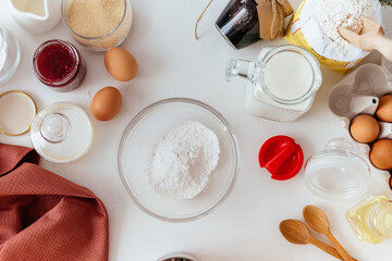 Girl cooks Christmas cupcakes in the kitchen