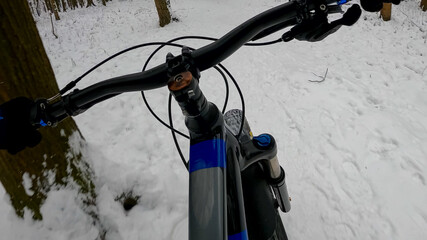 Amateur enduro rider on the bicycle in the winter season