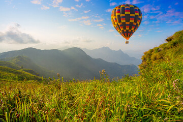 Mountain scenery with hot air balloons and beautiful sky