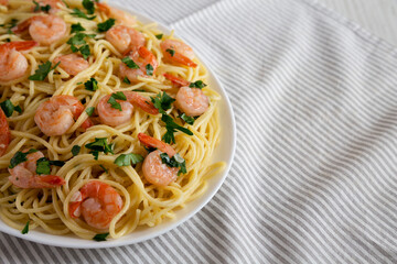 Homemade Shrimp Scampi with Pasta, side view. Copy space.