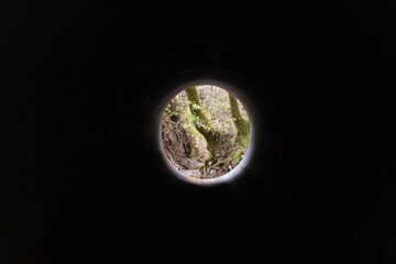green planet earth from inside a tunnel 