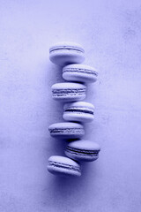 Stack of macarons, macaroons French cookie toned with Very Peri color