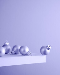 Several light Christmas balls on the shelf at the edge of the cliff.