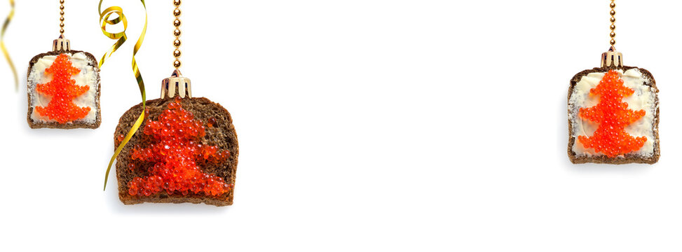 Red caviar on bread in the form of a Christmas toy. Design concept