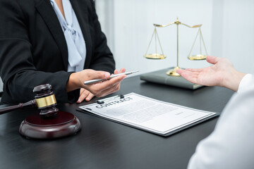 Male lawyer or counselor discussing negotiation legal case with client meeting with document contract in office, law and justice, attorney, lawsuit concept